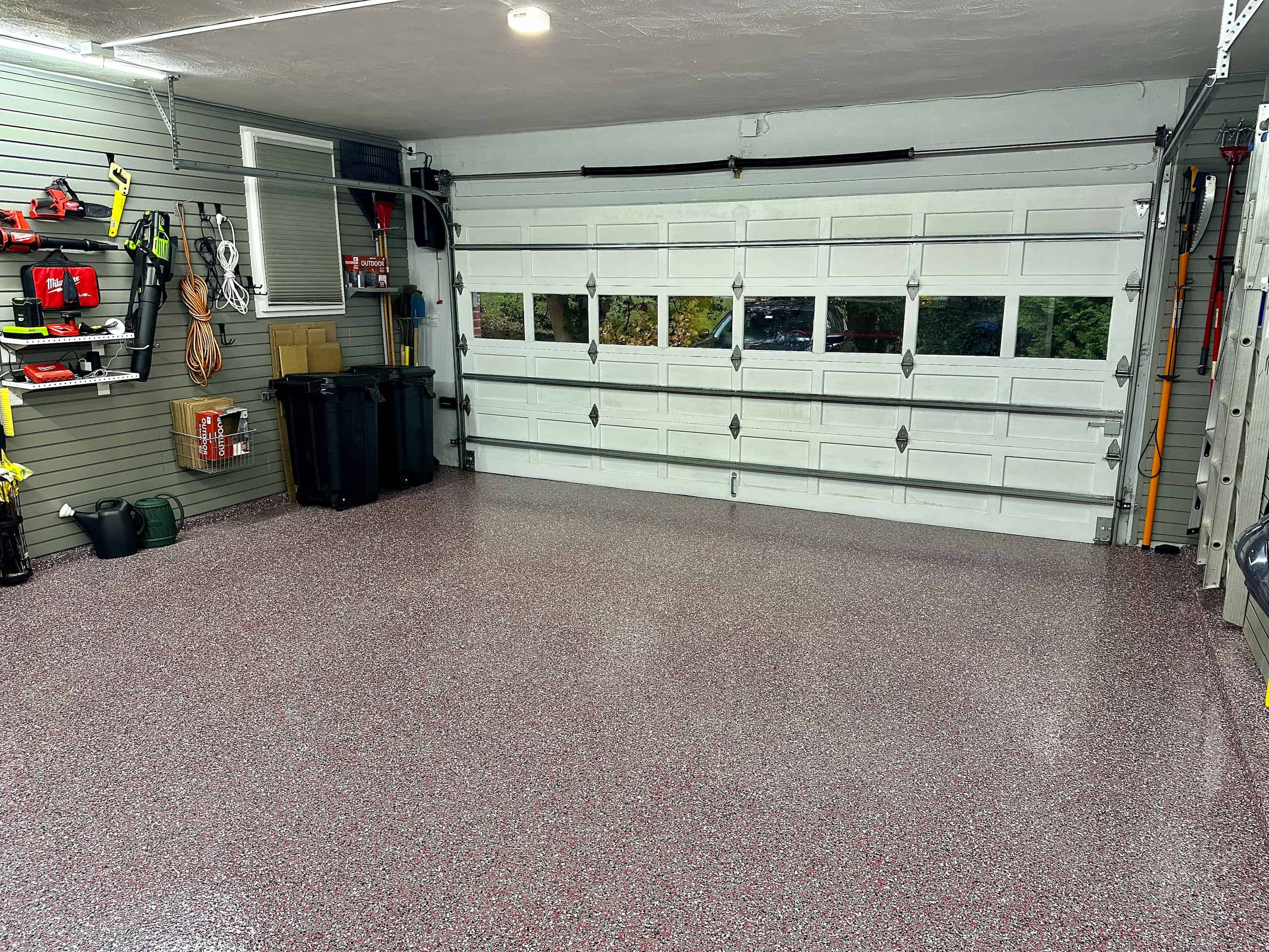 Red flakes in the floor with the door closed. A great lighting solution on a motion activated switch lights the space as you enter. No fumbling for a switch with arms full of groceries.
